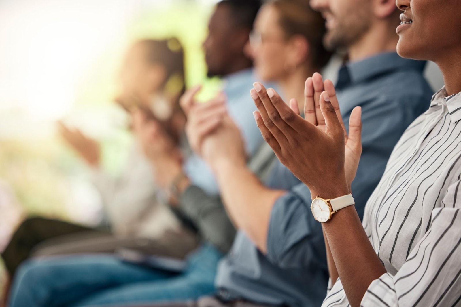 people clapping at a corporate event