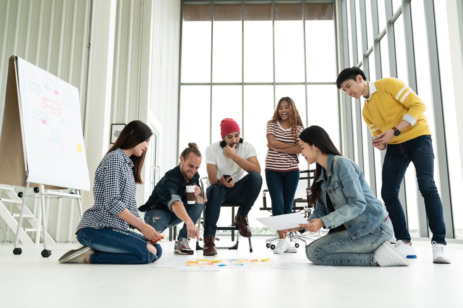 a group of people in a corporate setting working on a project