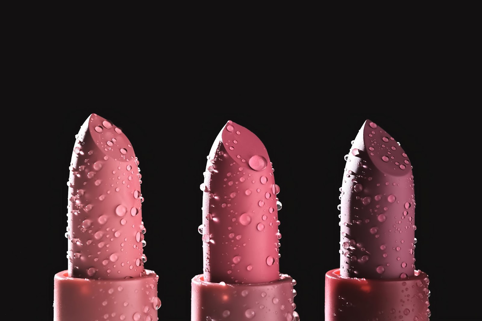 a group shot of three lipsticks in different shades