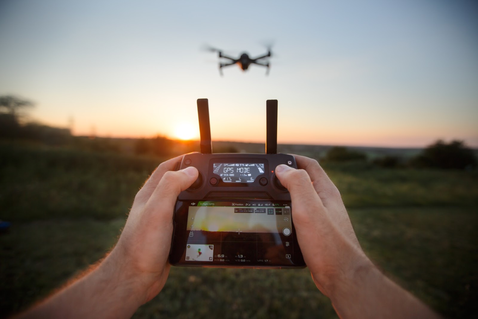 A man holding a drone remote control panel