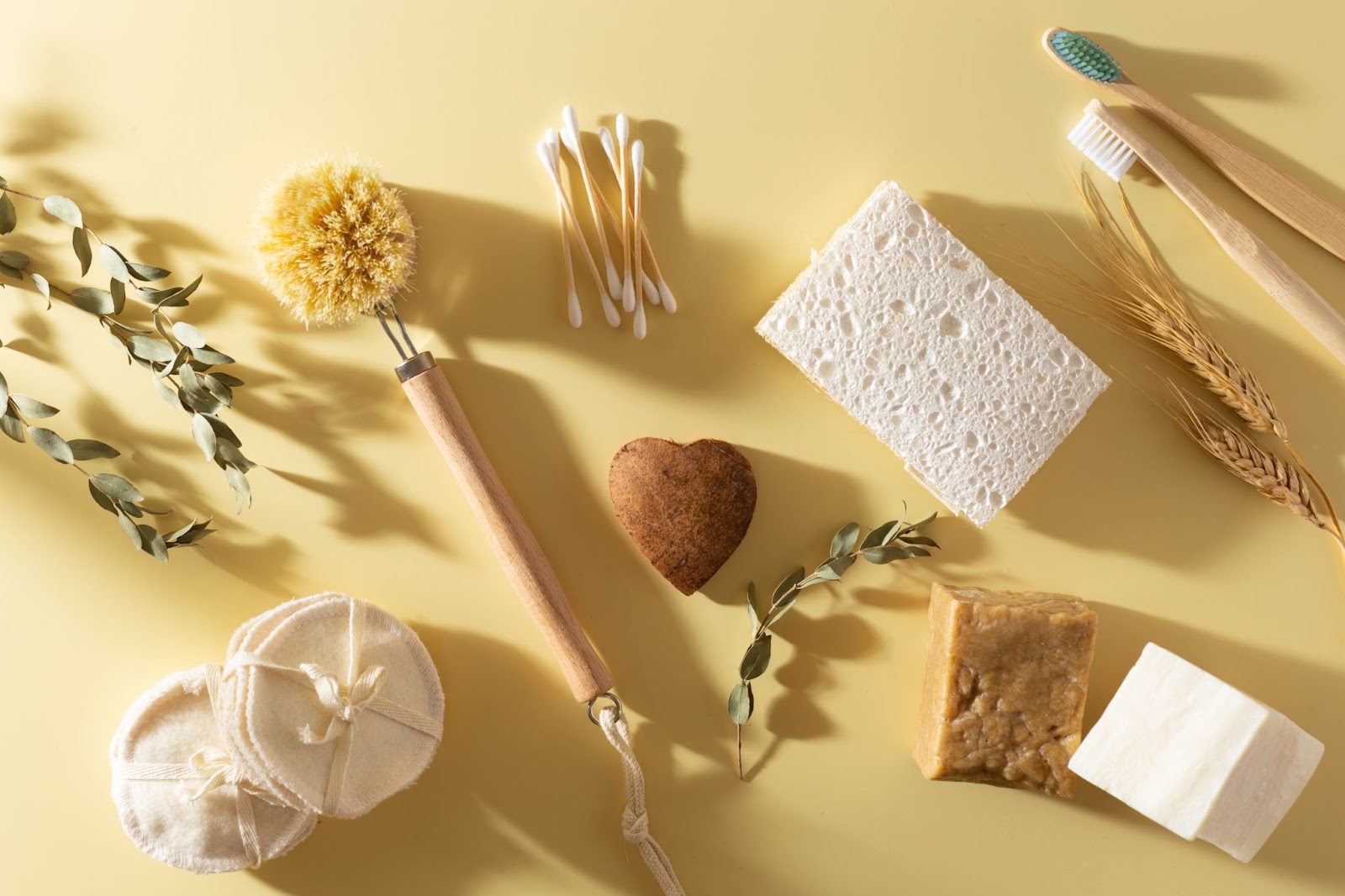 Coconut heart on eco-friendly flatlay with eco-friendly beauty products