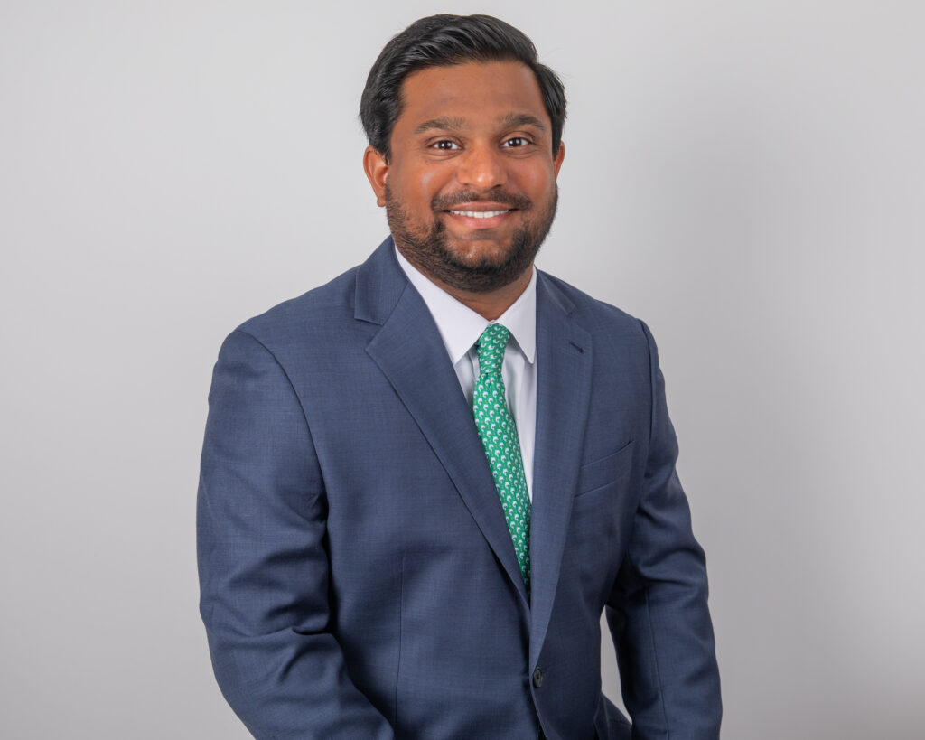 headshot outfit mistakes example with professional corporate suit and clean studio background