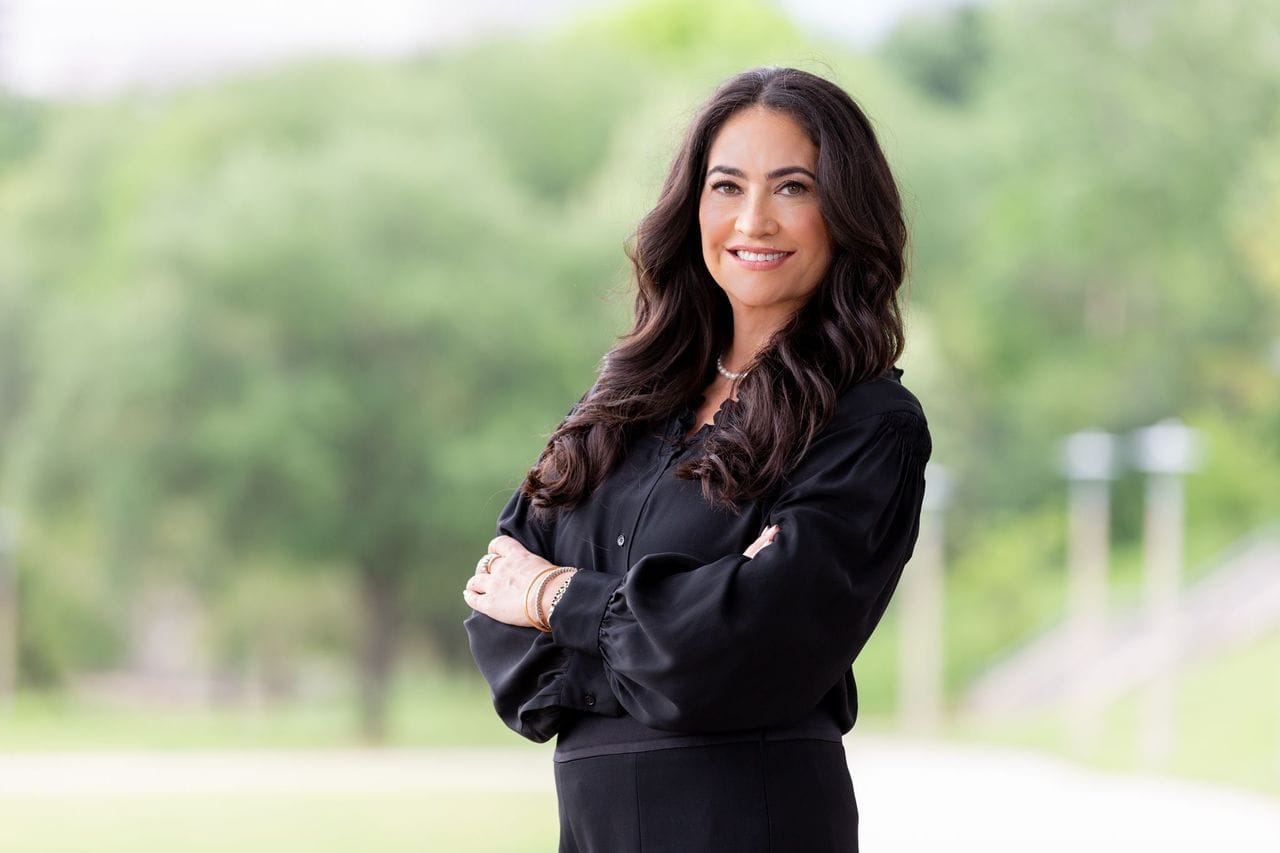 Executive headshot outdoors in Houston for real estate marketing.