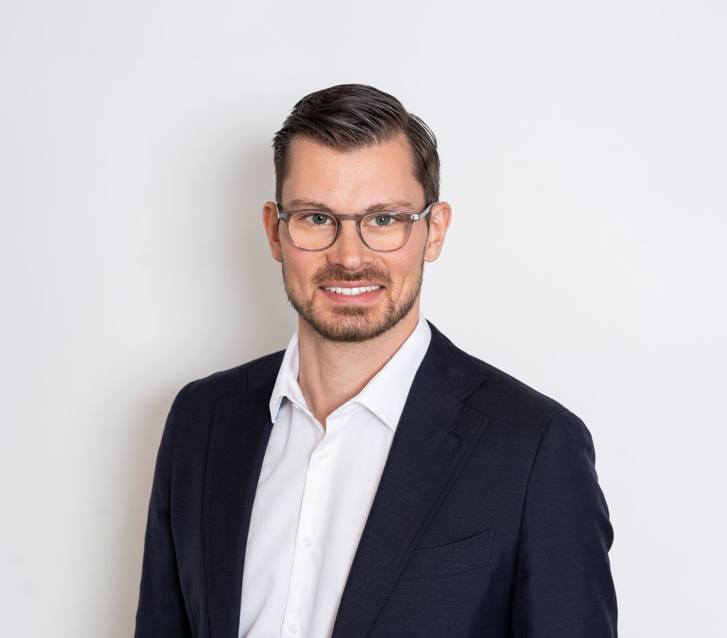Professional business headshot of a real estate agent