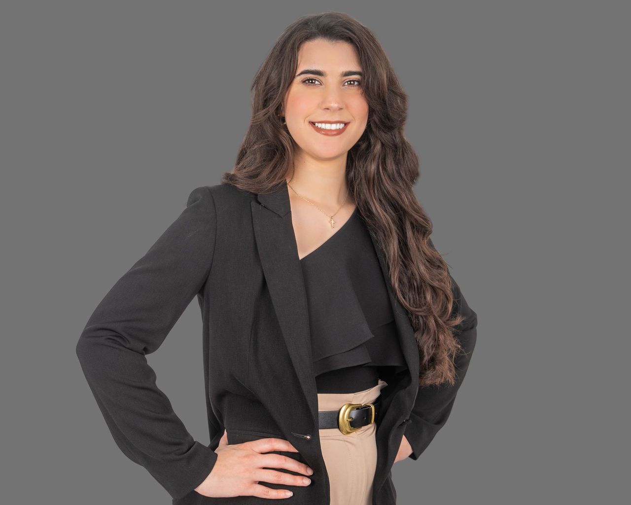 Confident female attorney in professional attire for headshots.