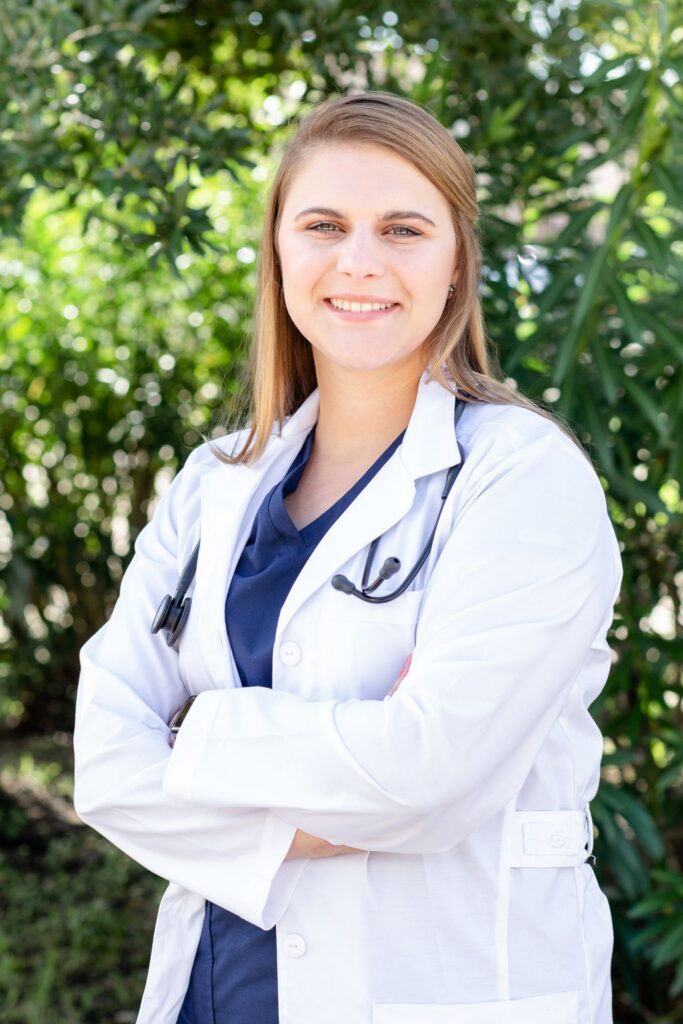 Healthcare headshot Houston — medical student in a white coat with stethoscope, outdoor session by Pixel Studio Productions