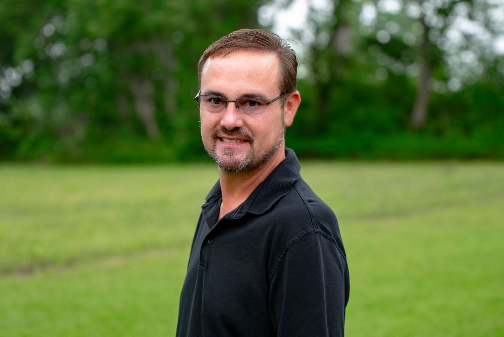 Russel Drone operator houston wearing a black collared shirt