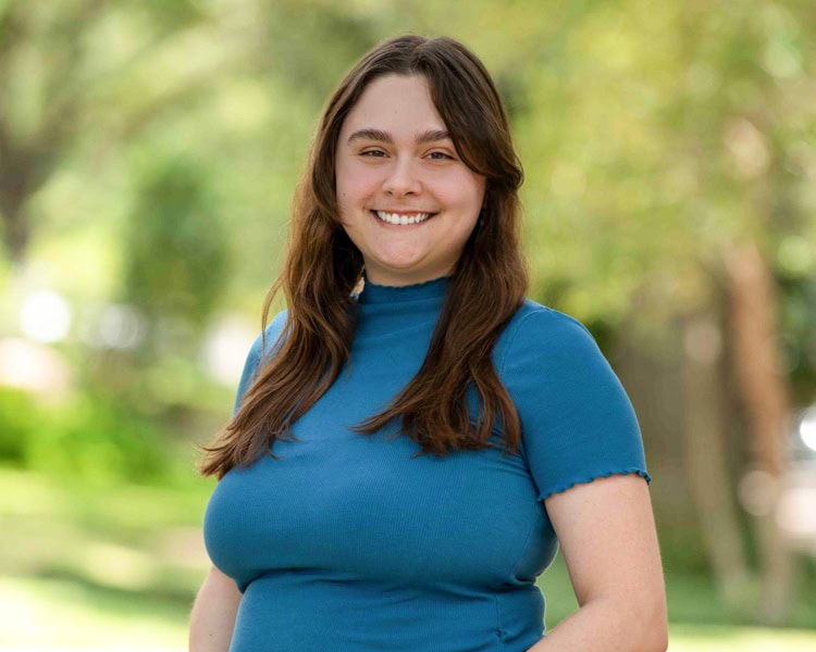 Lily employee at pixel studio productions outdoor headshot