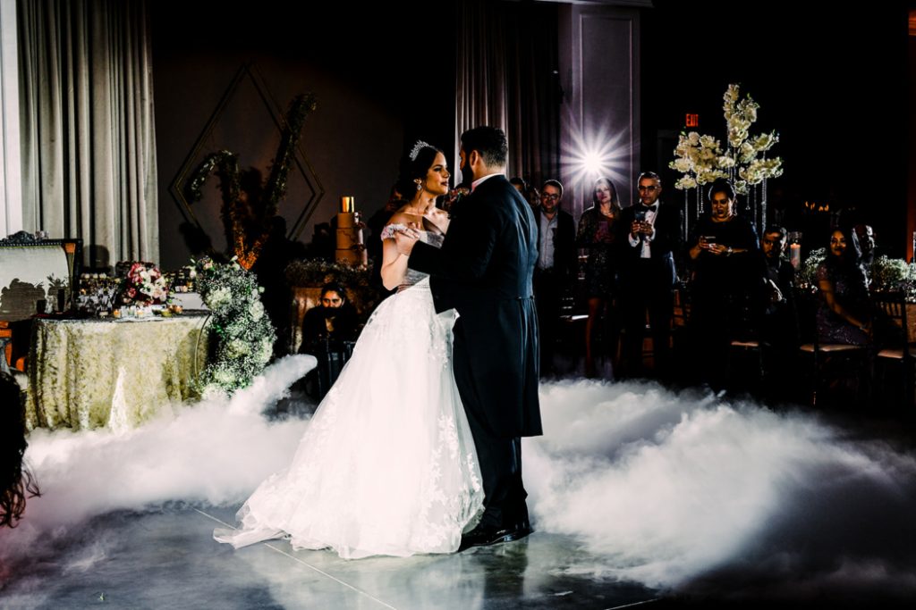 Bride and groom share their first dance in a wedding reception